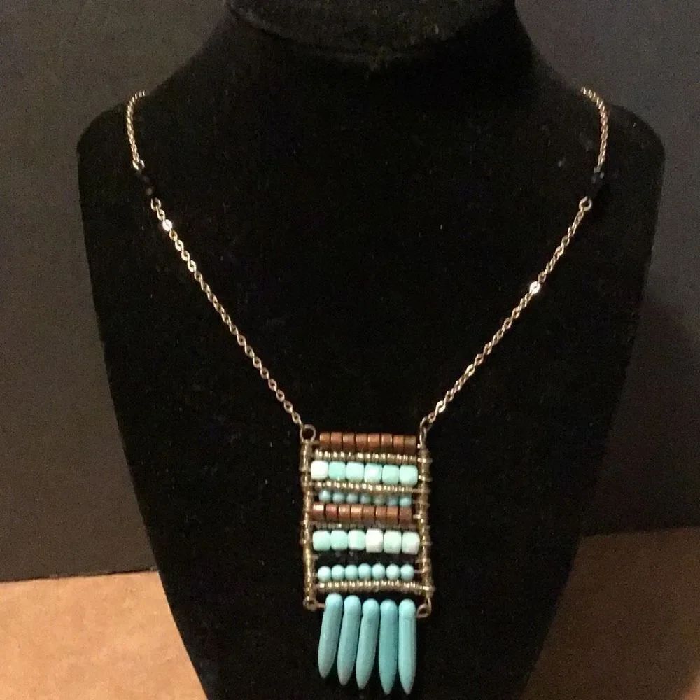 Necklace beautifully made, wood beads and turquoise on 18 inch chain